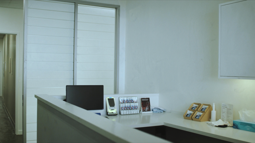 Modern dental office reception counter, representing dental front desk automation